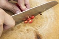 Sliced Ã¢â¬â¹Ã¢â¬â¹red peppers on a wood chopping board Royalty Free Stock Photo